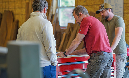 Experts at Cygnus Lumber reviewing wood. Contact Cygnus Lumber for consultations.