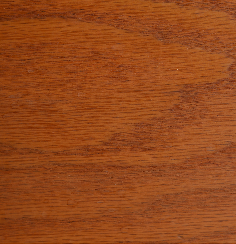 Hardwood grain swatch sample of Red Oak showing warm reddish-brown tone.