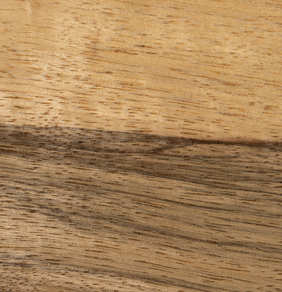 Wood grain swatch sample of Black Limba wood with contrasting grain patterns.