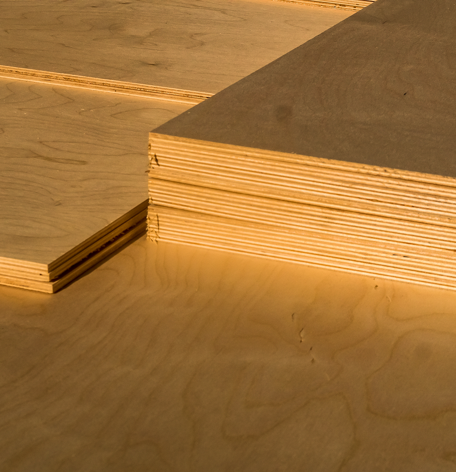 Stacked plywood sheets showing layered edges.