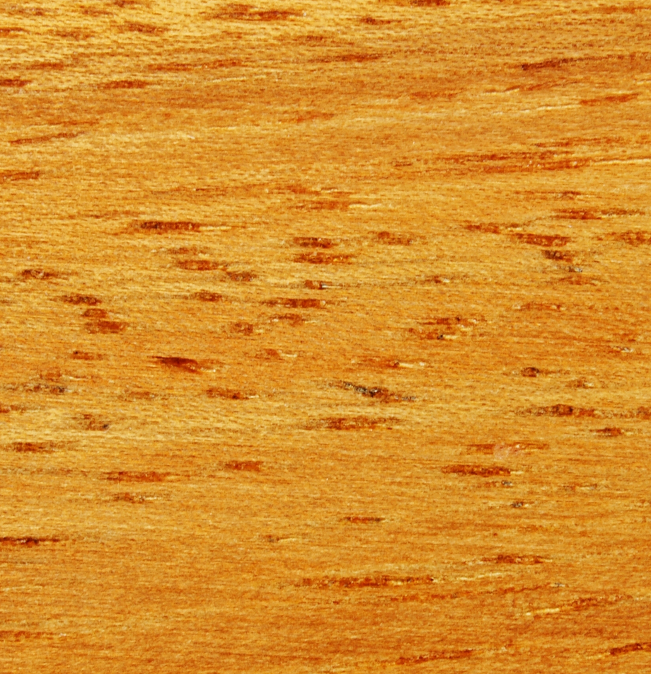 Wood grain swatch sample of Iroko wood showing yellowish-brown texture.